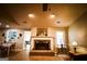 Bright and open living room with hardwood floors and cozy fireplace, next to the dining room at 155 Granby Ln, Fayetteville, GA 30215