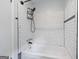 Clean, bright white tiled shower and tub combo at 120 Lakeside Dr, Ellenwood, GA 30294