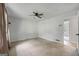 Spacious bedroom with ceiling fan, closet, and neutral carpet offers a relaxing retreat at 120 Lakeside Dr, Ellenwood, GA 30294