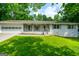 Traditional home with attached garage, shutters, and a cozy front porch at 120 Lakeside Dr, Ellenwood, GA 30294