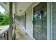 Welcoming front porch features gray trim, a decorative wreath and convenient overhead lighting at 120 Lakeside Dr, Ellenwood, GA 30294