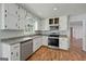 Efficient kitchen features stainless steel appliances and white cabinetry at 120 Lakeside Dr, Ellenwood, GA 30294