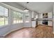 Bright kitchen with hardwood floors, stainless steel appliances, and white cabinets at 120 Lakeside Dr, Ellenwood, GA 30294