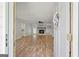 Inviting living room showcasing hardwood floors, a stone fireplace, and neutral paint at 120 Lakeside Dr, Ellenwood, GA 30294