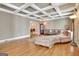 Inviting living room with coffered ceilings, hardwood floors, and comfortable sectional sofa at 100 Smokerise Trce, Peachtree City, GA 30269