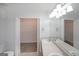 Bathroom with double sinks, a large mirror and walk in closet at 634 Skyline Dr, Villa Rica, GA 30180