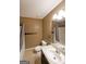 Bathroom with a single sink, cream tile flooring and shower/tub combo at 634 Skyline Dr, Villa Rica, GA 30180