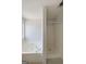 White bathroom featuring a tub and separate shower at 634 Skyline Dr, Villa Rica, GA 30180