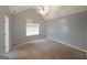 Bedroom with high ceilings, neutral walls and carpet, and a ceiling fan at 634 Skyline Dr, Villa Rica, GA 30180