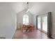 Bright dining room with hardwood floors, modern lighting, and access to the outdoors at 634 Skyline Dr, Villa Rica, GA 30180