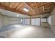 Spacious garage with multiple car doors, ample lighting, and a workbench area, ready for use at 634 Skyline Dr, Villa Rica, GA 30180
