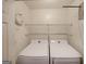 Laundry room with washer, dryer, and shelving at 634 Skyline Dr, Villa Rica, GA 30180