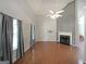Spacious living room with high ceilings, a fireplace, large windows, and hardwood floors at 634 Skyline Dr, Villa Rica, GA 30180