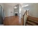 Open living room featuring hardwood floors, fireplace, and staircase at 634 Skyline Dr, Villa Rica, GA 30180
