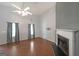 Bright living room features hardwood floors, high ceilings, fireplace, and large windows at 634 Skyline Dr, Villa Rica, GA 30180