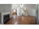 Open-concept area showcasing the fireplace, hardwood floors, and staircase at 634 Skyline Dr, Villa Rica, GA 30180