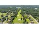 Stunning aerial view of 595 McGarity Dr, showcasing the golf course and lush landscaping surrounding the neighborhood at 595 Mcgarity Dr, Mcdonough, GA 30252