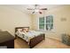 Comfortable bedroom with a ceiling fan, window, and playful decor; perfect for  at 595 Mcgarity Dr, Mcdonough, GA 30252