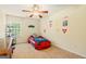 Themed ' bedroom featuring a race car bed, ceiling fan, and colorful decor at 595 Mcgarity Dr, Mcdonough, GA 30252