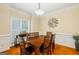Formal dining room boasts wood floors, large window, and elegant trim at 595 Mcgarity Dr, Mcdonough, GA 30252