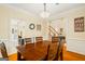 Cozy dining room featuring wood floors and trim with an open doorway at 595 Mcgarity Dr, Mcdonough, GA 30252