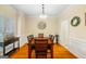 Elegant dining room with wood floors, modern lighting, and wainscoting at 595 Mcgarity Dr, Mcdonough, GA 30252