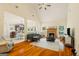 Spacious living room featuring a vaulted ceiling, fireplace, and open layout at 595 Mcgarity Dr, Mcdonough, GA 30252