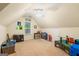 Spacious playroom with a sloped ceiling, ceiling fan, and plenty of room for activities at 595 Mcgarity Dr, Mcdonough, GA 30252