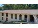 Charming exterior featuring a unique arched balcony and well-maintained facade at 6266 Auburn Dr, Riverdale, GA 30296