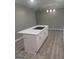 Kitchen island featuring white cabinets and drawers with quartz countertops at 6266 Auburn Dr, Riverdale, GA 30296