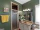 Well-lit bathroom with a shower and a spacious vanity with a vessel sink at 141 Wexford Ct, Stockbridge, GA 30281