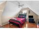 Bedroom featuring wood floors, ceiling fan, large window, and vaulted ceiling at 141 Wexford Ct, Stockbridge, GA 30281