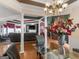 Open-concept layout showcasing dining area with glass table flowing into the inviting living room at 141 Wexford Ct, Stockbridge, GA 30281