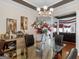 Spacious dining area featuring glass table, adjacent to open-concept living space for seamless flow at 141 Wexford Ct, Stockbridge, GA 30281
