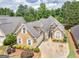 Inviting exterior with manicured landscaping, charming curb appeal, and an attached garage at 141 Wexford Ct, Stockbridge, GA 30281