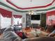 Inviting living room features a fireplace, hardwood floors, custom ceiling and plenty of natural light at 141 Wexford Ct, Stockbridge, GA 30281
