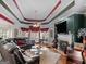 Spacious living room features hardwood floors, custom ceiling, fireplace, and a comfortable leather sofa at 141 Wexford Ct, Stockbridge, GA 30281