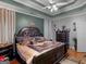 Comfortable main bedroom featuring a ceiling fan, carpet flooring, and an ensuite bathroom at 141 Wexford Ct, Stockbridge, GA 30281