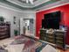 Beautiful main bedroom with dark furniture, tv, and a door leading to a closet space at 141 Wexford Ct, Stockbridge, GA 30281