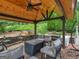 Gazebo featuring outdoor seating, fan, wooden ceiling, and brick flooring at 141 Wexford Ct, Stockbridge, GA 30281