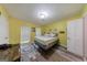Bright bedroom featuring neutral walls, wood flooring, and a comfortable bed with decorative accents at 105 N River Dr # G, Sandy Springs, GA 30350