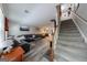 Bright living room flows seamlessly into the dining area with a staircase leading to the upper level at 105 N River Dr # G, Sandy Springs, GA 30350