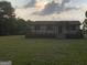 Inviting single-story home with a spacious front deck and a well-maintained lawn at 276 Oakland Rd, Mcdonough, GA 30253