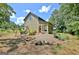 Tranquil backyard setting with a cozy fire pit and swing, perfect for relaxation and outdoor gatherings at 460 Morgan Mill Rd, Brooks, GA 30205