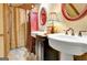 The bathroom features double sinks, vanity, tiled floors, and a framed mirror at 460 Morgan Mill Rd, Brooks, GA 30205