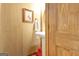 Bathroom with white sink and rustic wooden walls, creating a cozy atmosphere at 460 Morgan Mill Rd, Brooks, GA 30205