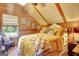 Comfortable bedroom featuring wood paneled walls, a cozy bed, and a relaxing ambiance at 460 Morgan Mill Rd, Brooks, GA 30205