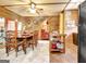 Inviting dining area featuring wood paneling, ceiling fan, and staircase access at 460 Morgan Mill Rd, Brooks, GA 30205