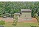 Home exterior featuring a carport, patio area, and well-maintained landscaping at 460 Morgan Mill Rd, Brooks, GA 30205