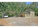 Charming home exterior featuring a carport, patio area, and well-maintained landscaping at 460 Morgan Mill Rd, Brooks, GA 30205